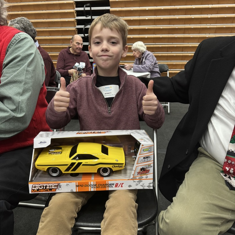 students at Christmas party with new toy