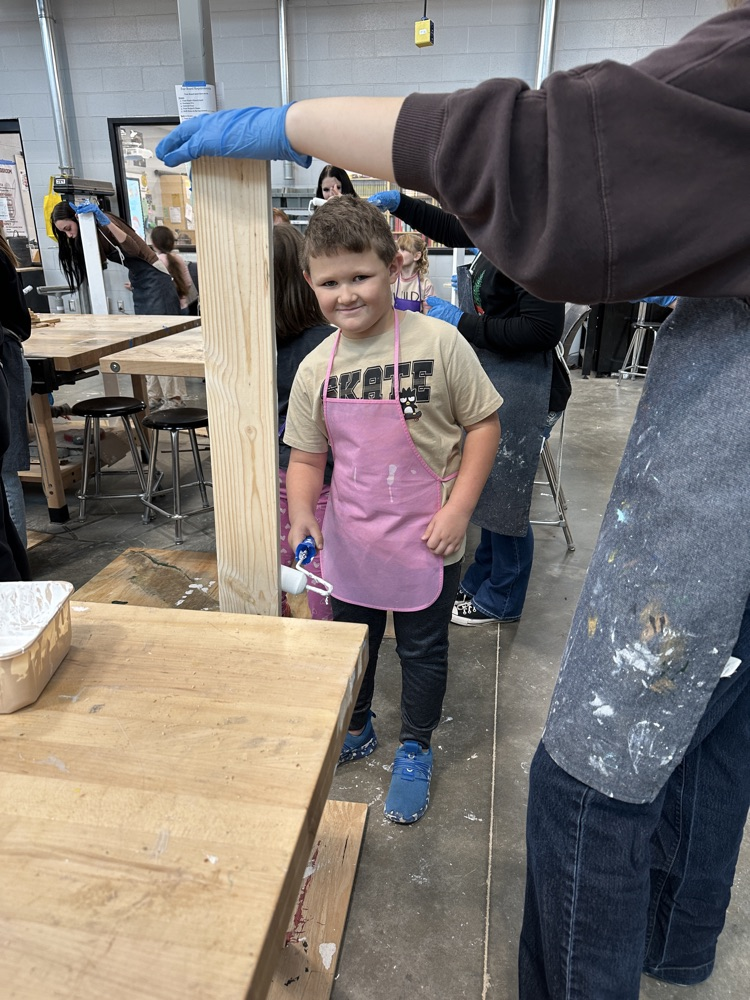 students in shop painting