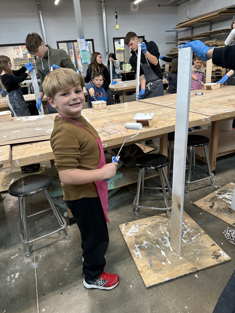 students in shop painting
