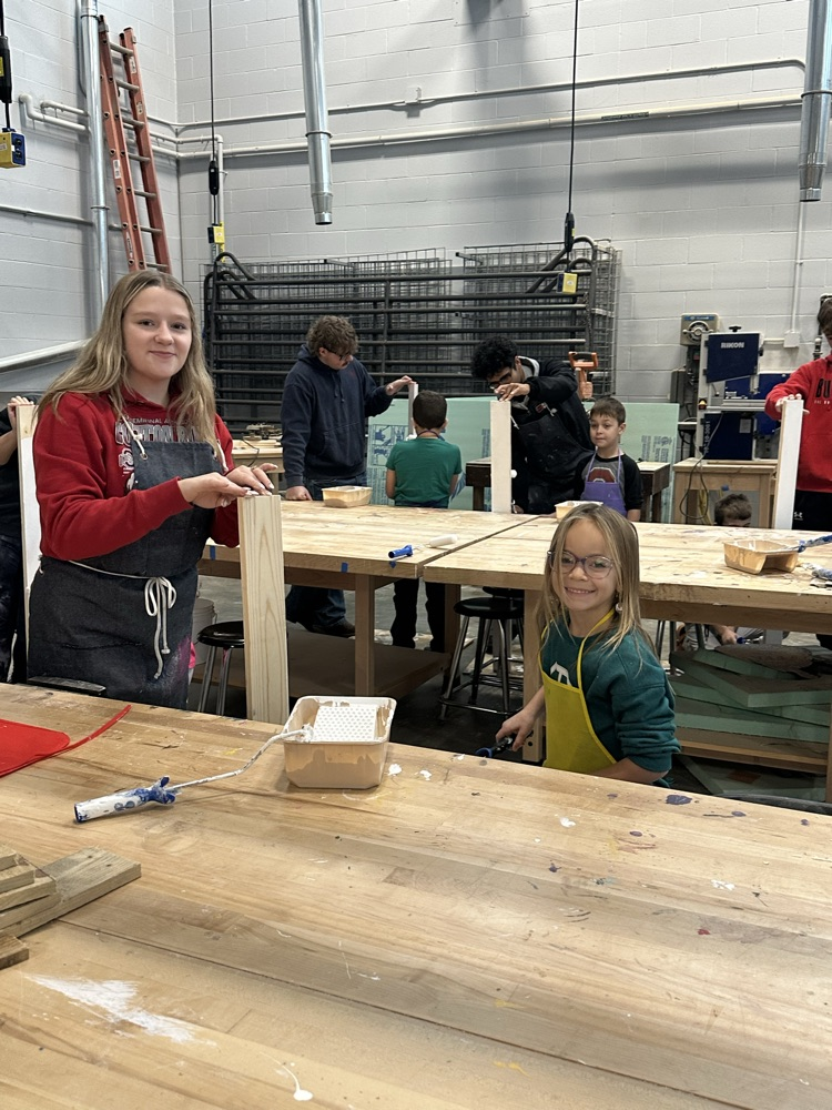 students in shop painting