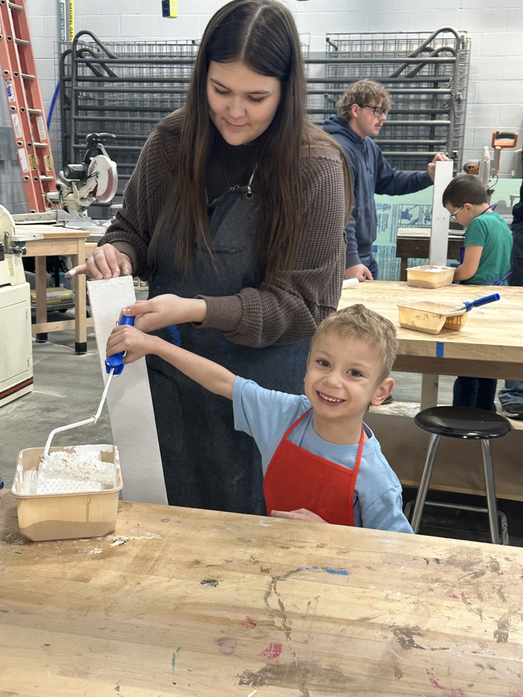 students in shop painting