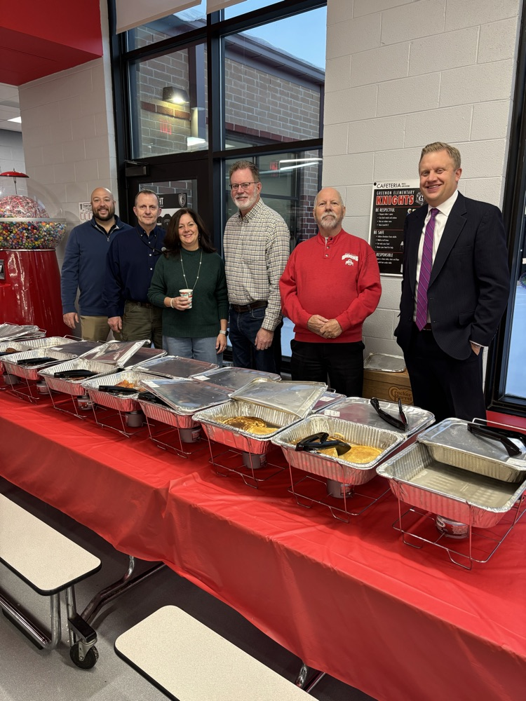 people standing behind food