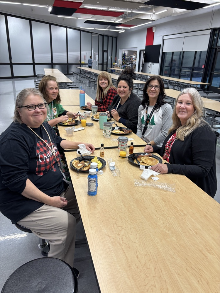people eating at breakfast tables