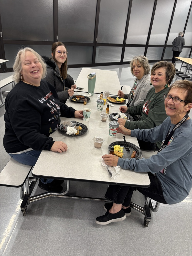 people eating at breakfast tables