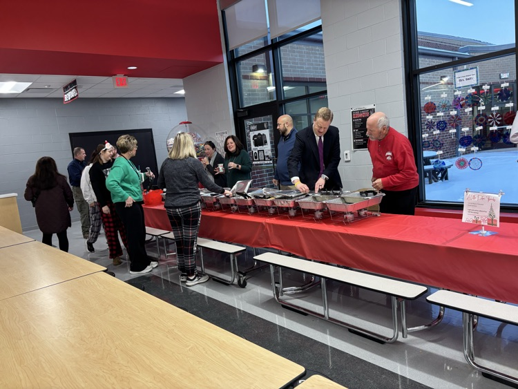 people serving breakfast
