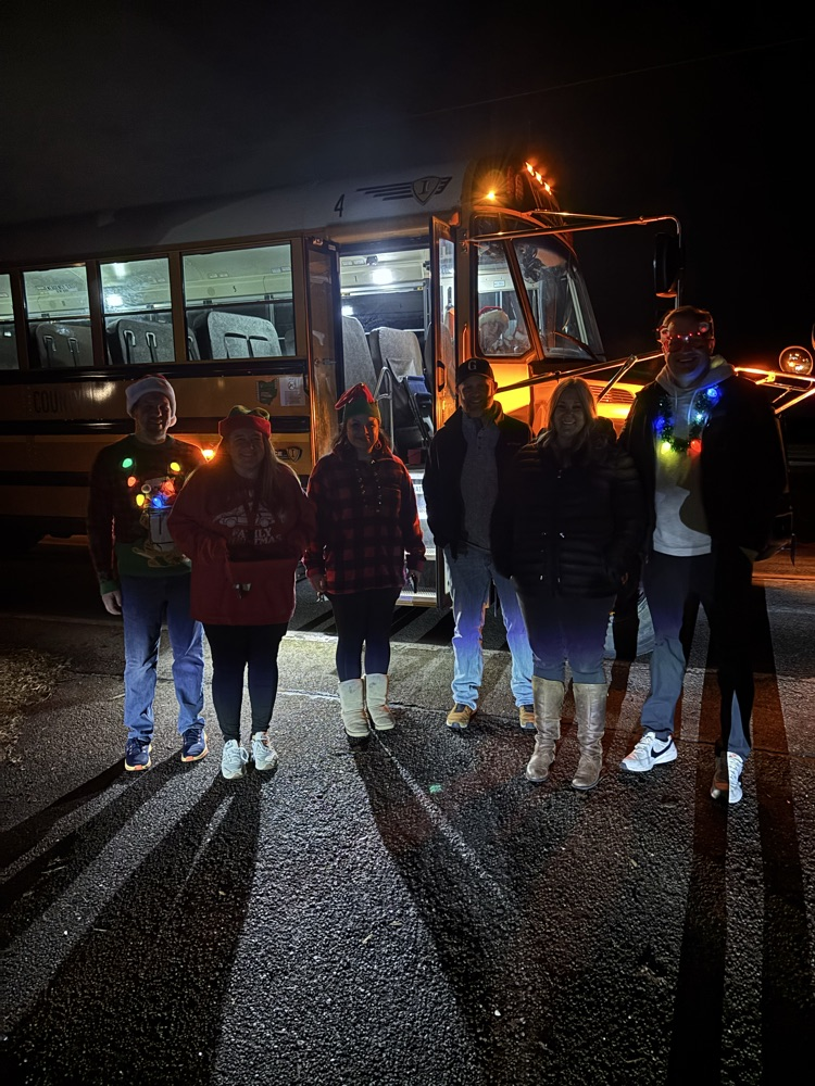 staff standing outside bus