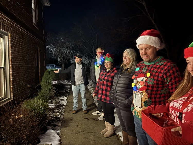staff singing in festive clothing