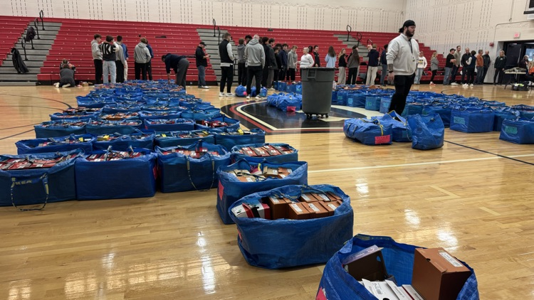 gym full of shoes and kids