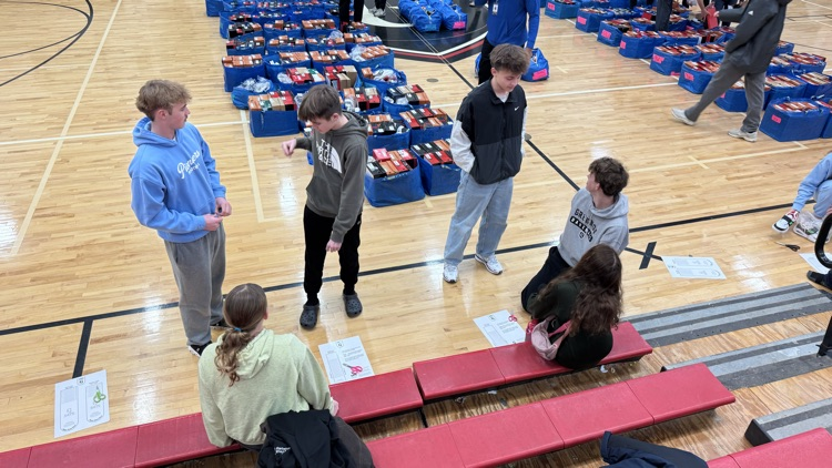 gym full of shoes and kids