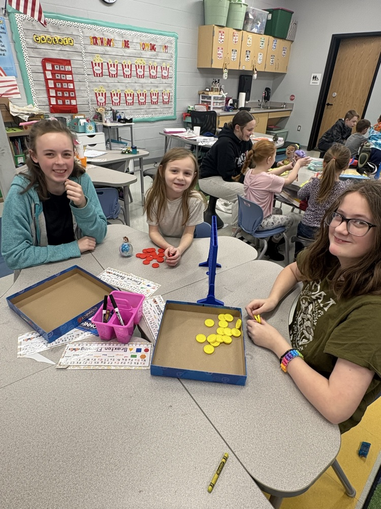 students in classroom playing games 