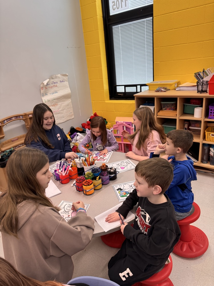students in classroom playing games 