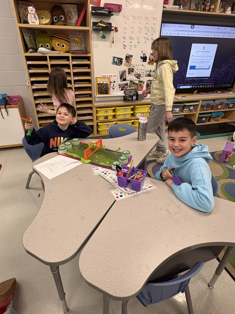 students in classroom playing games 