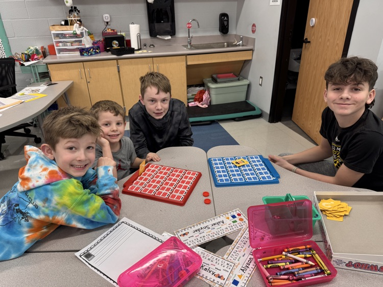 students in classroom playing games 