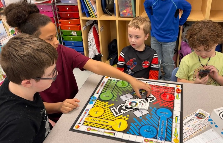 students in classroom playing games 