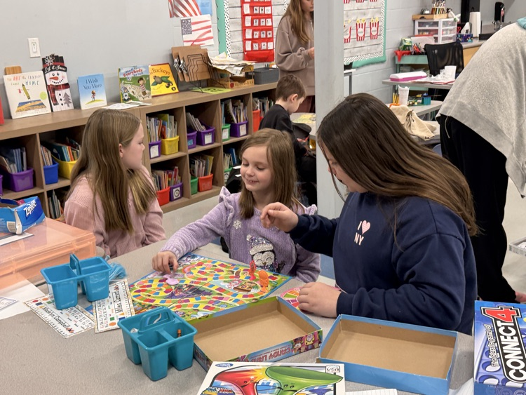 students in classroom playing games 