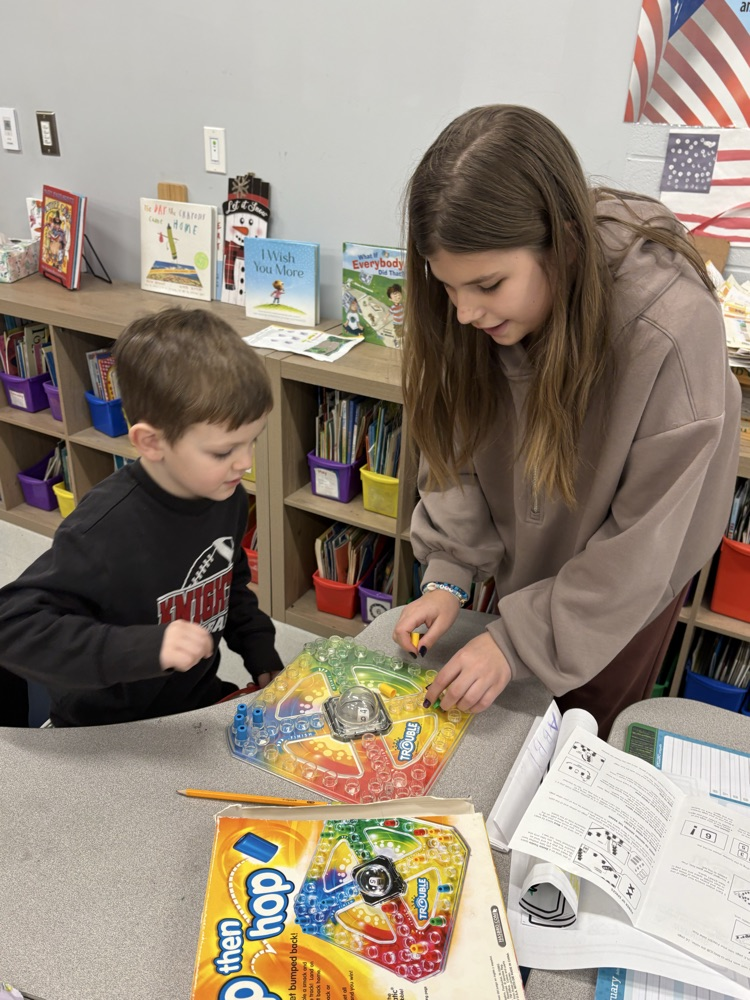 students in classroom playing games 