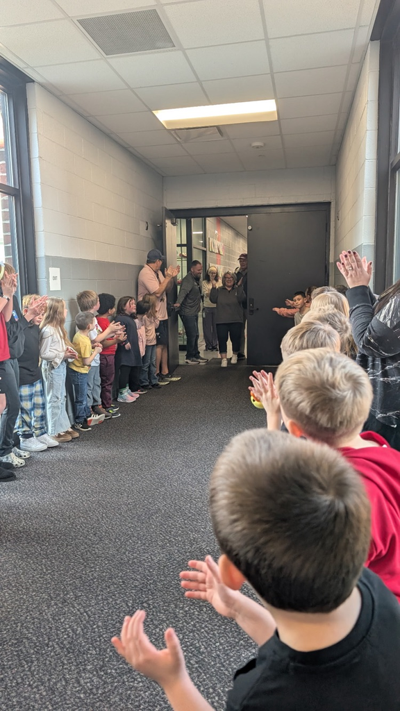 man opening door with kids clapping