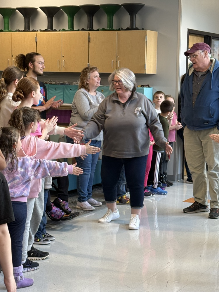 kids clapping in hallway