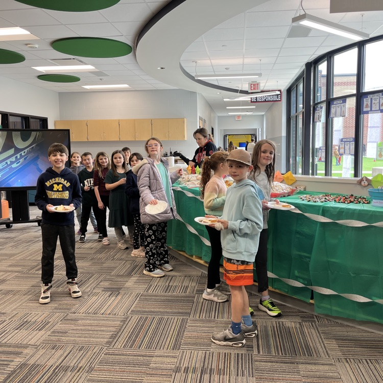 students waiting for food with plates