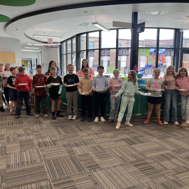 students in a group waiting for food