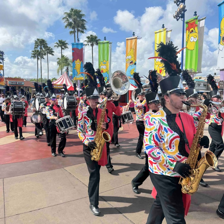marching band marching in street