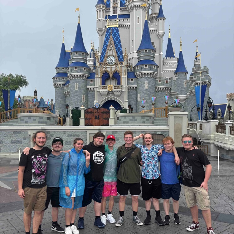 group of students in front of castle