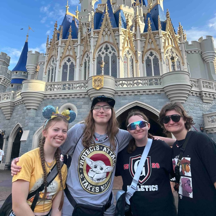 group of students in front of castle
