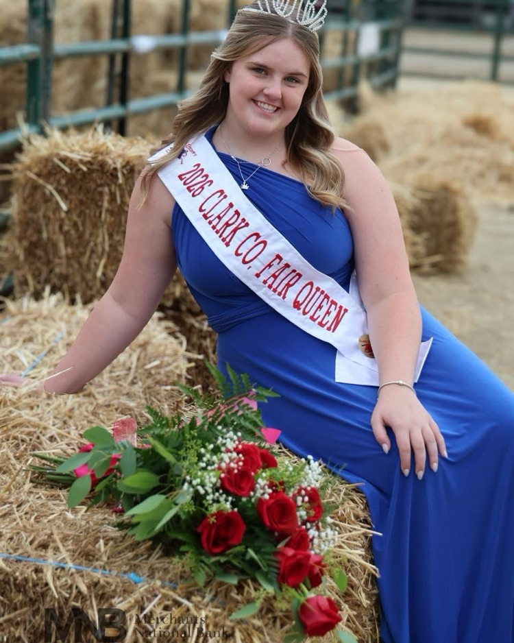 girl in blue dress with sash