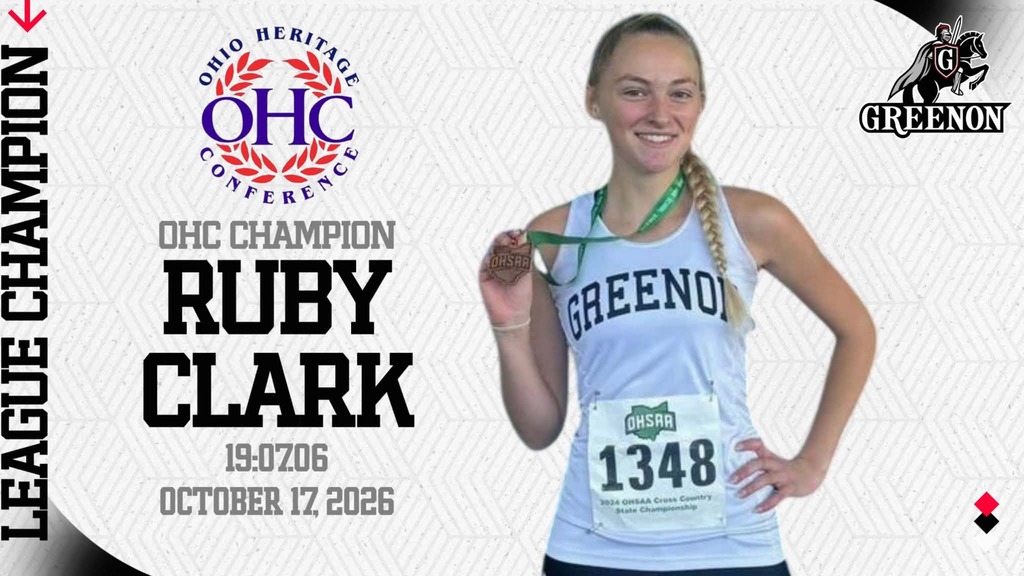 Young woman wearing a white tank top with the number 1348 holds a medal and smiles.