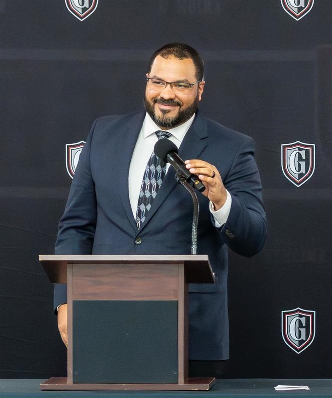 man speaking at podium