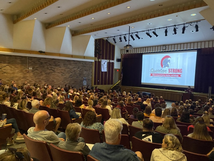 faculty and staff fill the auditorium