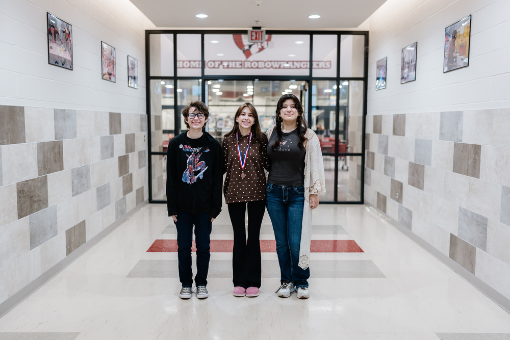 3 People Standing for Photo