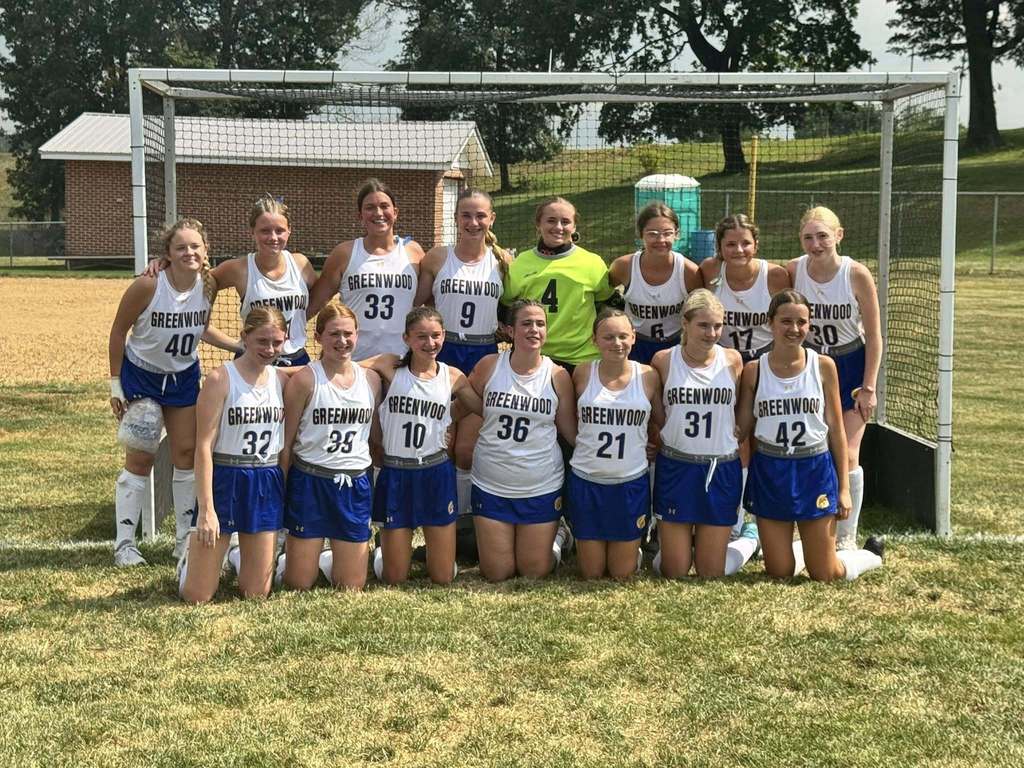 Greenwood Field Hockey Team on a field