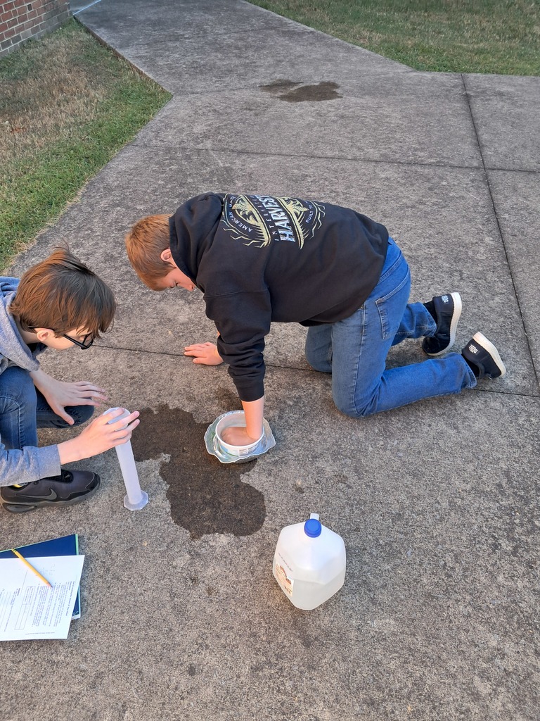 boy putting hand in water