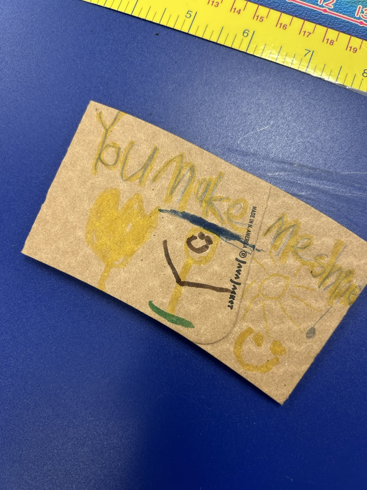 student designed. coffee sleeve with the saying “you make me shine"