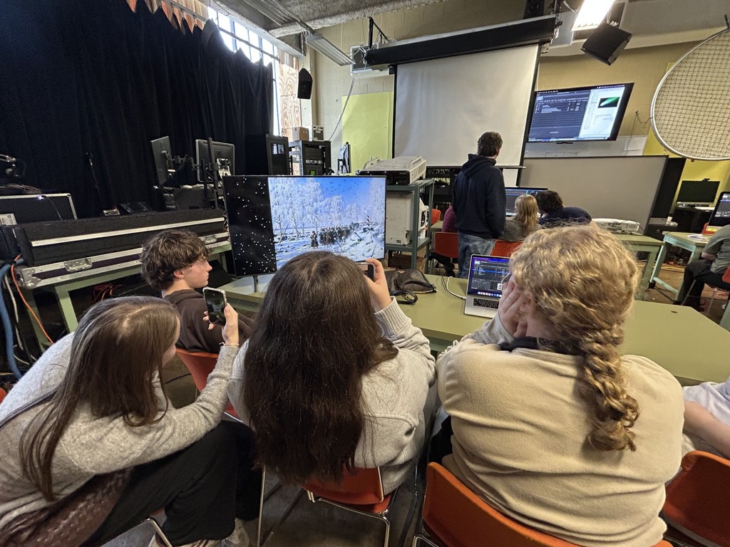 Students learning about projection techniques and producing their own slideshow.