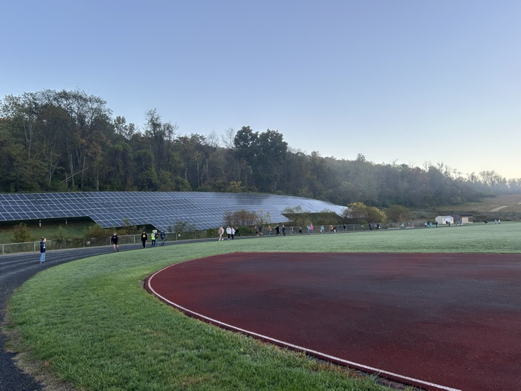 elementary students walking on the track