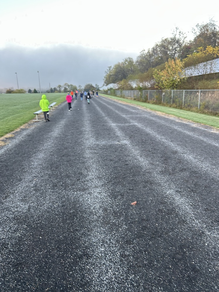 elementary students walking on the track