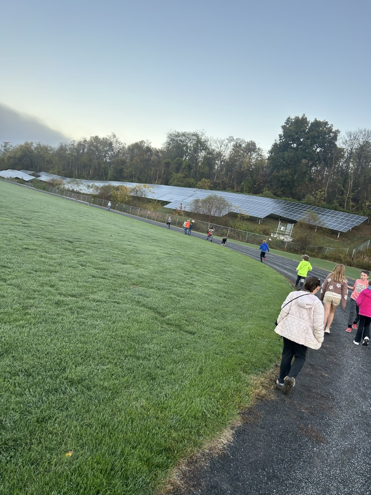 elementary students walking the track