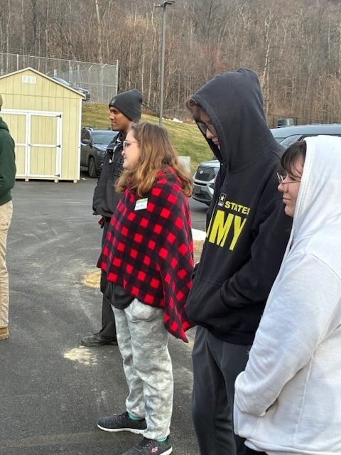 Shelby Strawser from Greenwood looks on as troopers provide a tour at the Newport State Police Barracks.