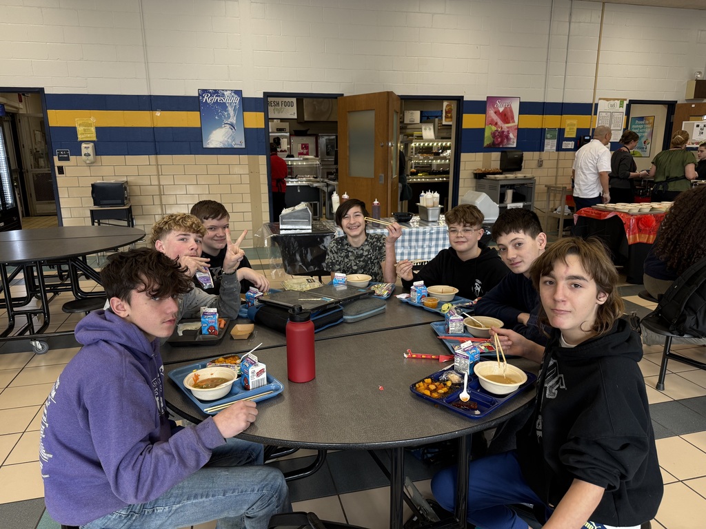 Middle School students enjoying specially made Ramen Noodle Bowls