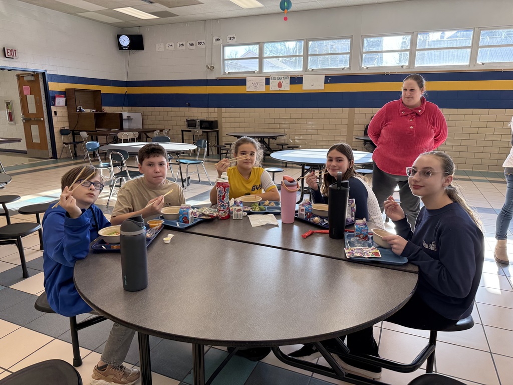 Middle School students enjoying specially made Ramen Noodle Bowls