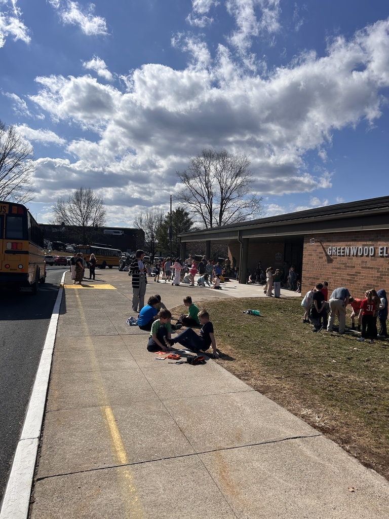 Students playing and drawing on the front portico
