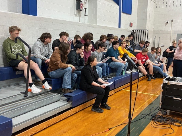 Greenwood and Newport students get instructions from Angie Barlup from Belco Credit Union. 