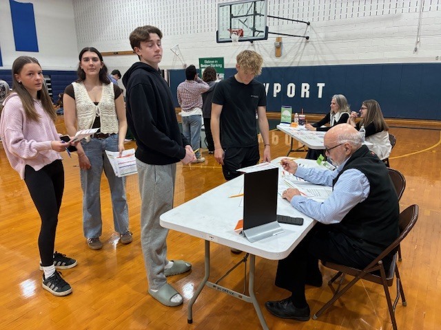 Perry County Commissioner, Frank Campbell helps Greenwood students work through a financial simulation at Newport High School.
