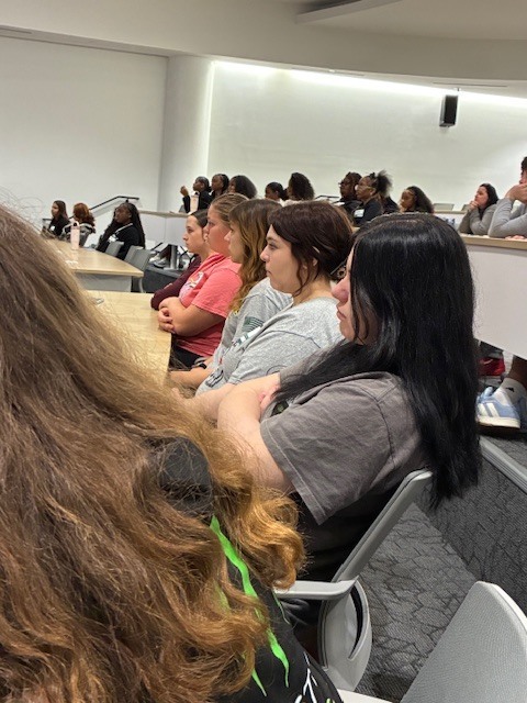 Greenwood students listen to a panel of experts including a surgeon, pediatric physical therapist, and more at HU's Healthcare Careers Day.