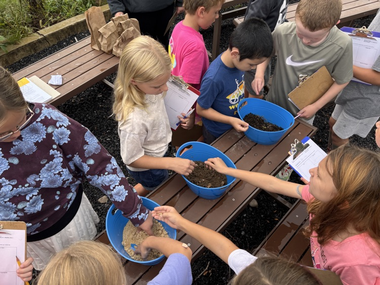 students feeling different soil composition