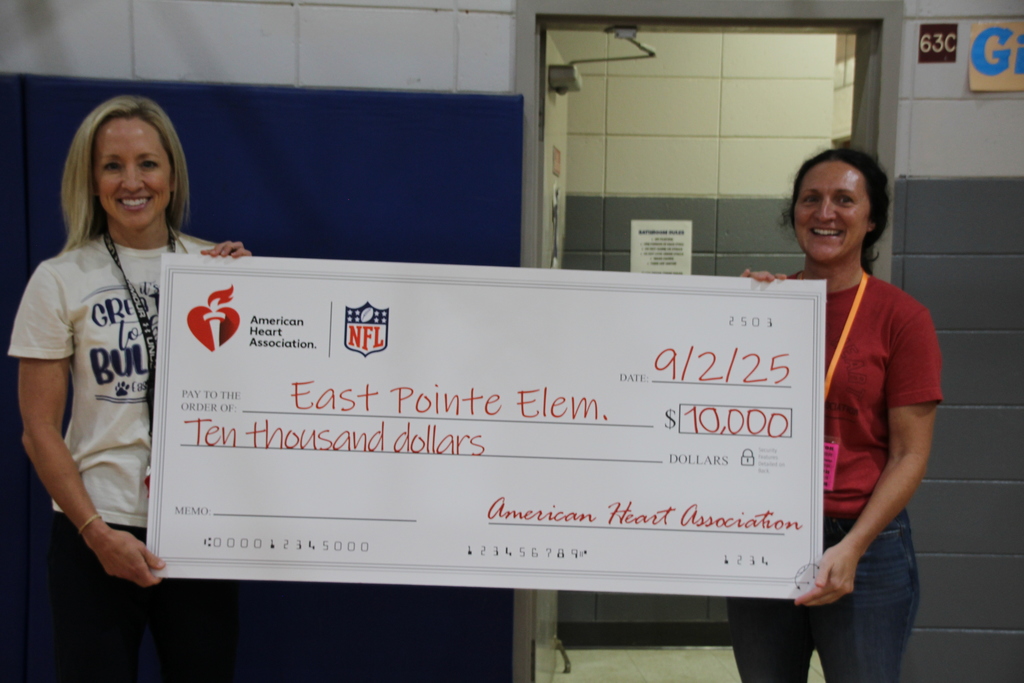 Laura accepting check
