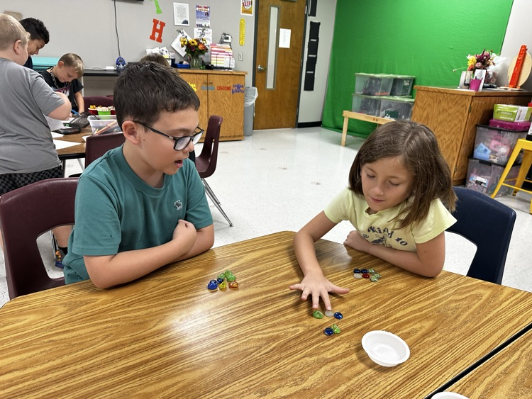 FabLab fun this week! Students learned five new math and strategy games to play with Mrs. Eckart. We practiced strategic thinking, multiplication, addition, and good sportsmanship, and had a blast doing it!