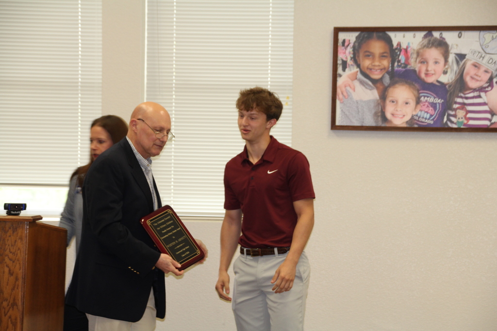 Weston receiving award